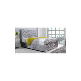 Silver crushed velvet bed frame with button-tufted headboard in bright bedroom setting