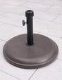 16kg brown round parasol base with polycrete finish on outdoor patio tiles