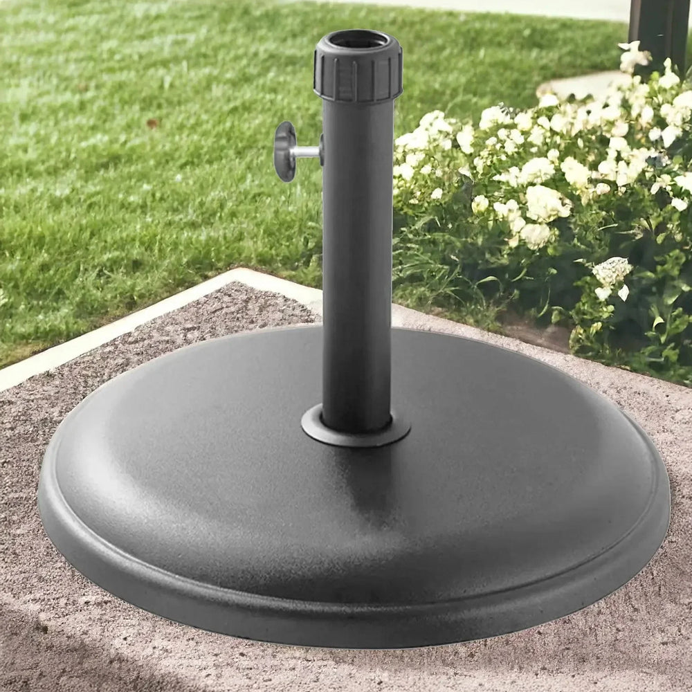 16kg light grey round parasol base polycrete on patio with garden background