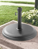 16kg light grey round parasol base polycrete on patio with garden background