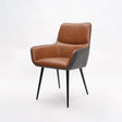 Brown faux leather dining chair with black metal legs and armrests on white background