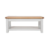 White wooden coffee table with oak top and lower storage shelf, front view