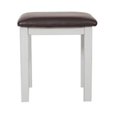 White wooden stool with brown leather seat cushion, front view