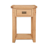Oak bedside table with single drawer and lower shelf, brass handle, front view