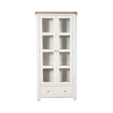 White display cabinet with glass doors and single drawer, natural wood top, front view