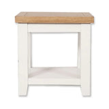 White painted side table with oak top and lower storage shelf, front view