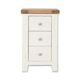 White bedside table with oak top and three drawers, front view