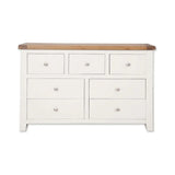 White wooden chest of drawers with oak top and six drawers, front view