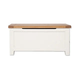 White wooden storage bench with oak lift-top lid, front view