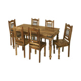 Rustic wooden dining table set with six matching chairs and carved chair backs