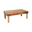 Solid wood coffee table with natural finish and turned legs on white background