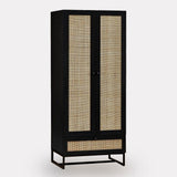 Black wood wardrobe with rattan panel doors and lower drawer on metal base