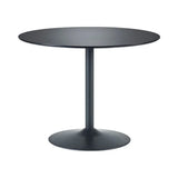 Round black dining table with single pedestal base and smooth tabletop