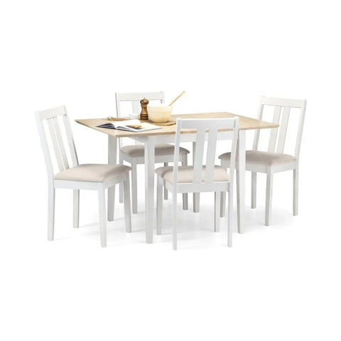 White wooden dining table set with four matching chairs and light wood tabletop
