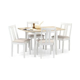 White wooden dining table set with four matching chairs and light wood tabletop