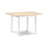 Rectangular dining table with light wood top and white legs, shown against a white background