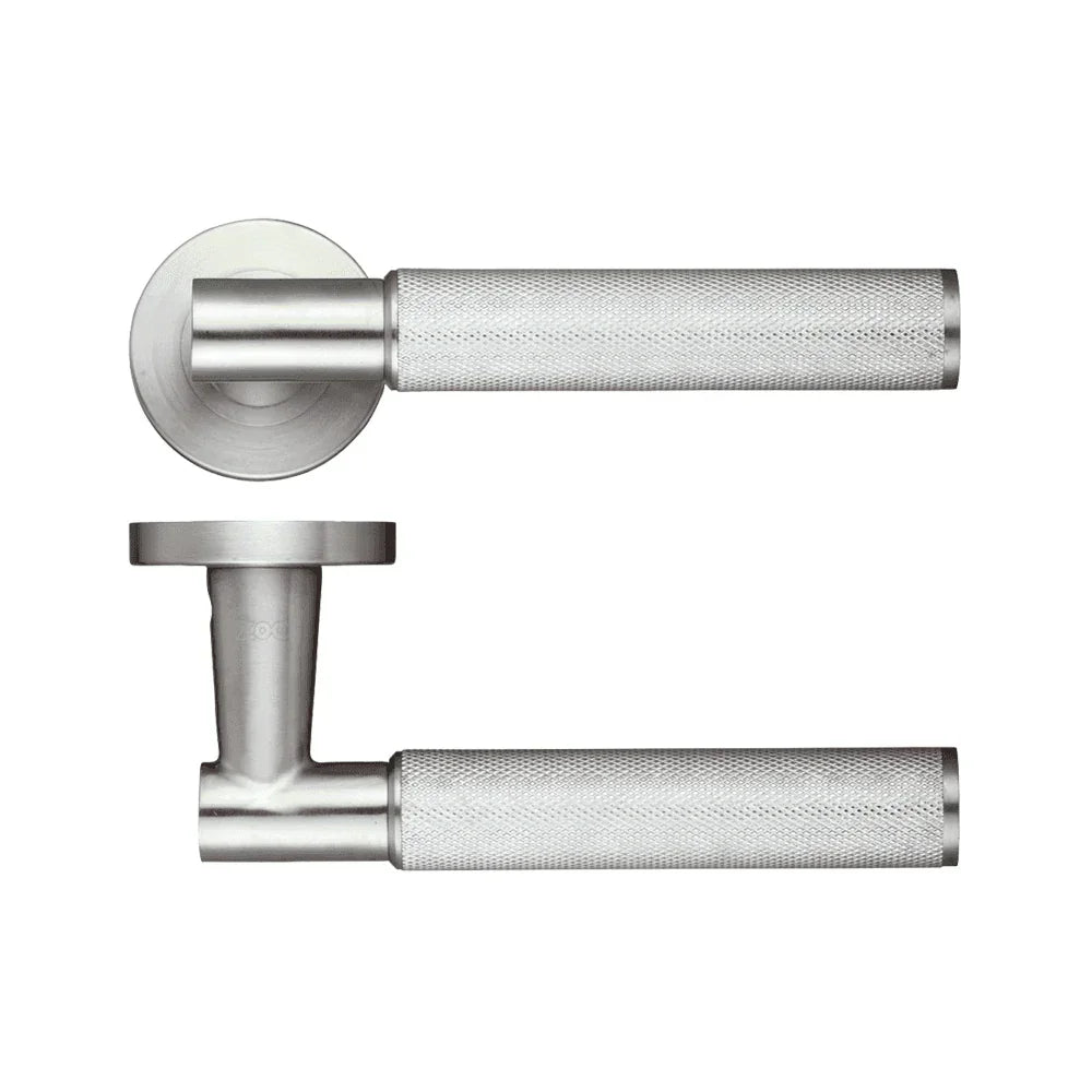 Brushed steel door handle set with textured grip and round rose design, side and front view