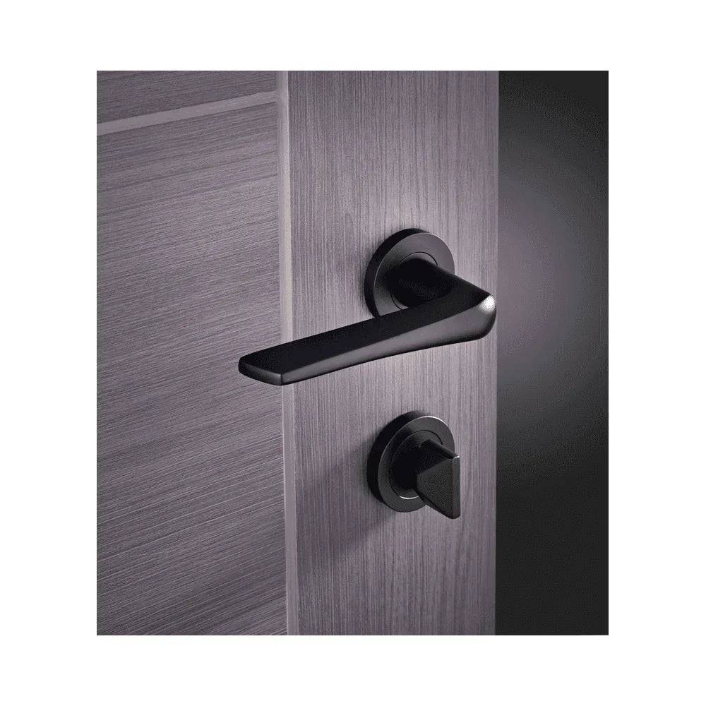 Matte black door handle with matching lock set on modern grey interior door