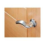 Close-up of a polished chrome lever door handle fitted to a light oak door, angled view