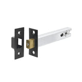 Matt black tubular door latch with a brass-coloured bolt and steel spindle bar, angled view