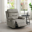 Cream armchair recliner with matching piping beside round black side table in bright living room