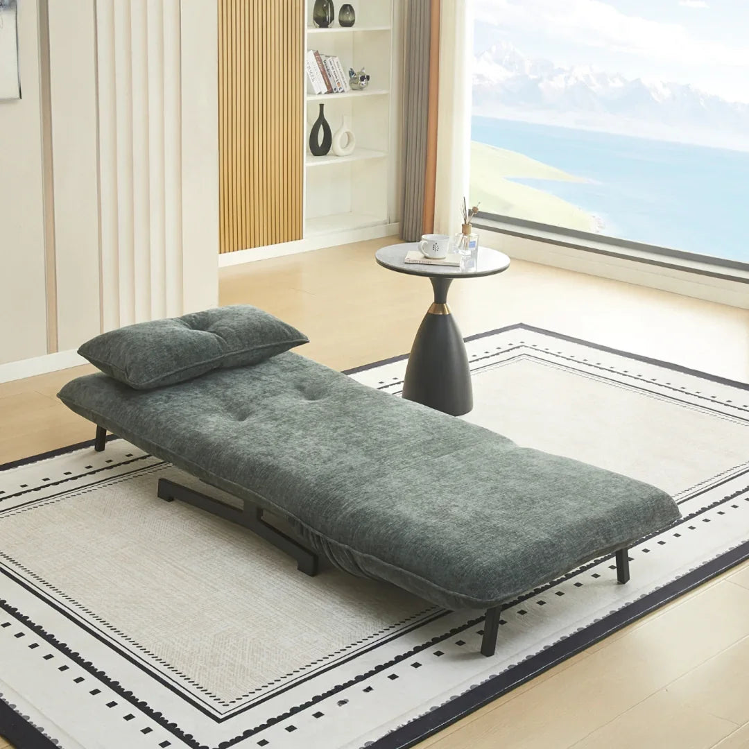 Single sofa bed in winter moss fabric open to bed on modern area rug near window