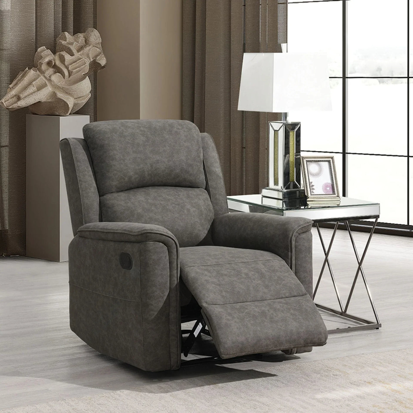 Grey fabric recliner chair with padded armrests in modern living room setting