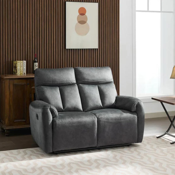 Dark grey two seater recliner sofa with plush fabric, shown in modern living room setting