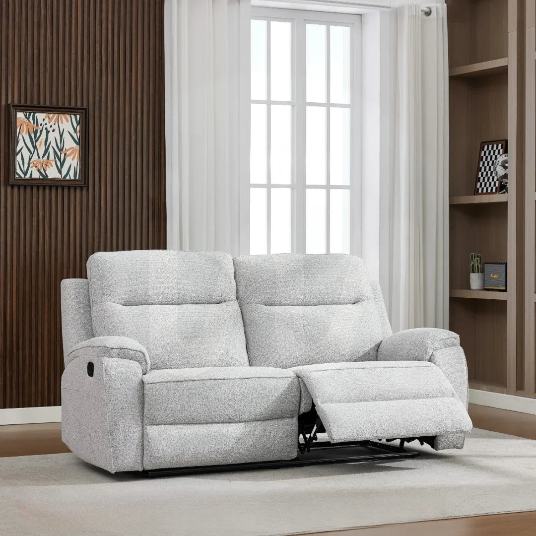 Light grey fabric recliner sofa with extended footrest in modern living room setting