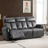 Dark grey recliner sofa with padded seats in modern living room setting
