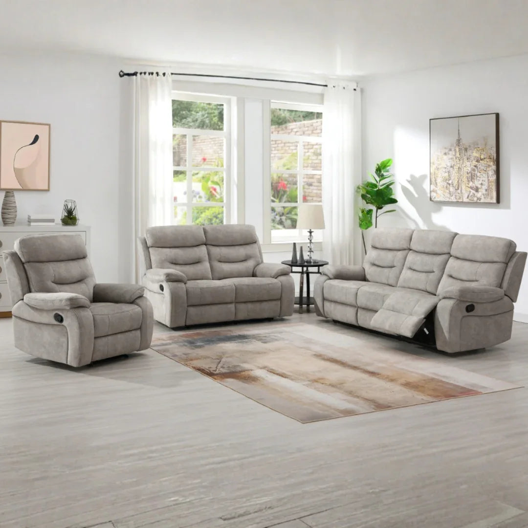 Cream reclining sofa set with matching piping in modern living room with large windows