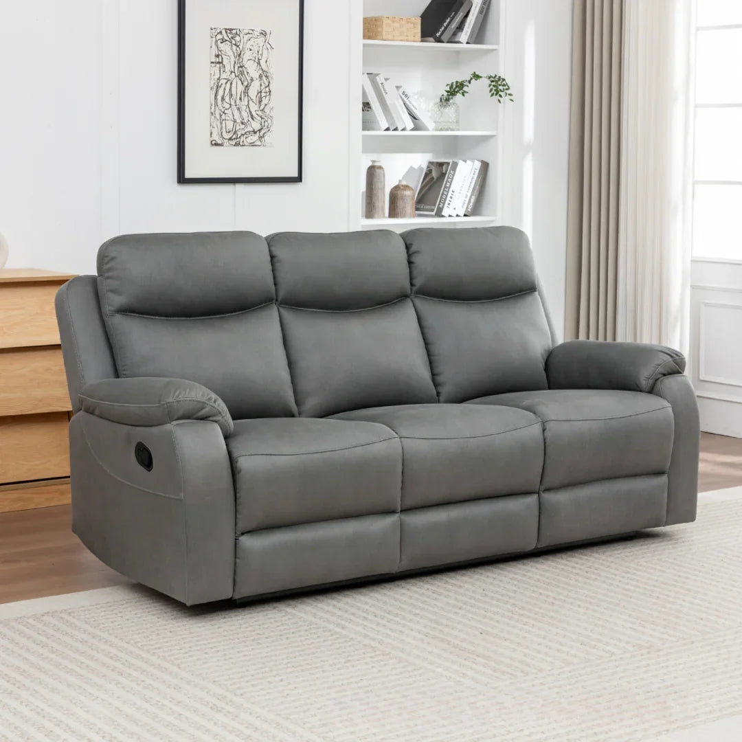 Charcoal three seater fabric sofa with plush cushions in modern living room setting