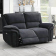 Dark grey fabric recliner sofa with extended footrest in a bright living room setting