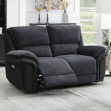 Dark grey fabric recliner sofa with extended footrest in a bright living room setting