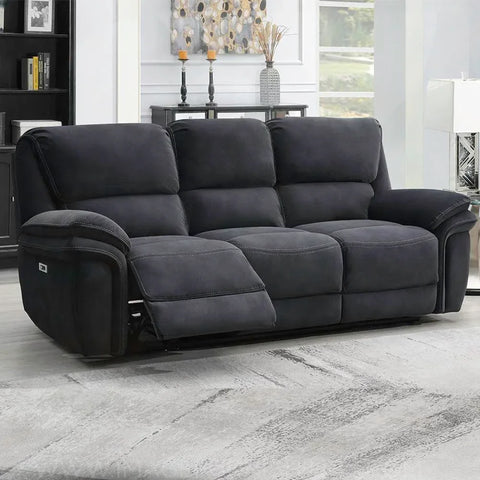 Dark grey fabric recliner sofa with footrest extended in modern living room setting