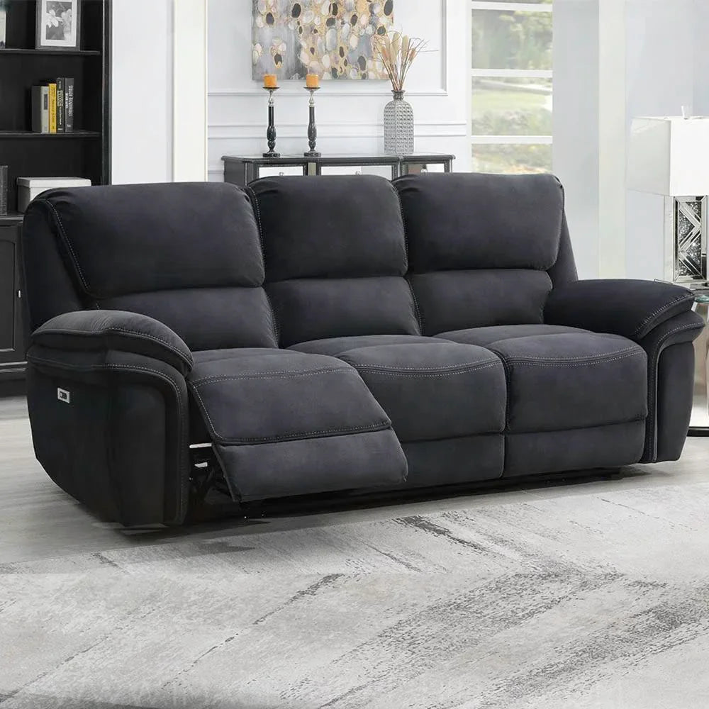Dark grey fabric recliner sofa with footrest extended in modern living room setting
