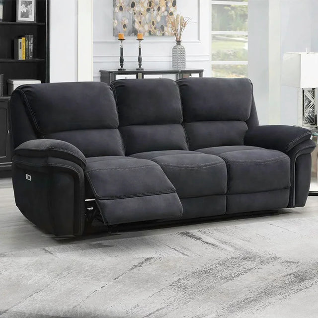 Dark grey fabric recliner sofa with footrest extended in modern living room setting