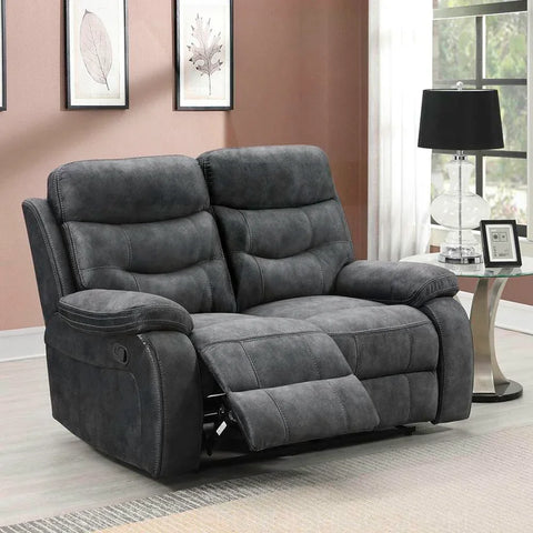 Dark grey fabric reclining sofa with padded armrests and backrest in living room setting