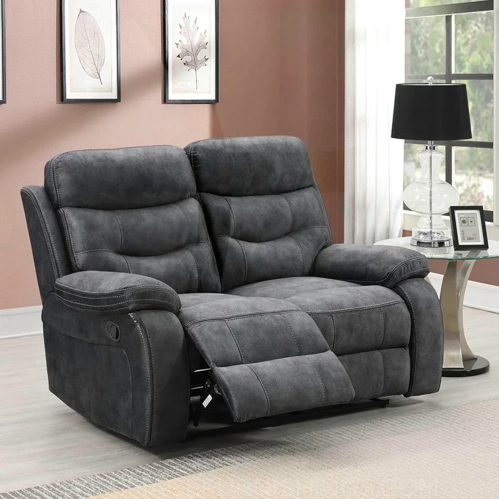 Dark grey fabric reclining sofa with padded armrests and backrest in living room setting