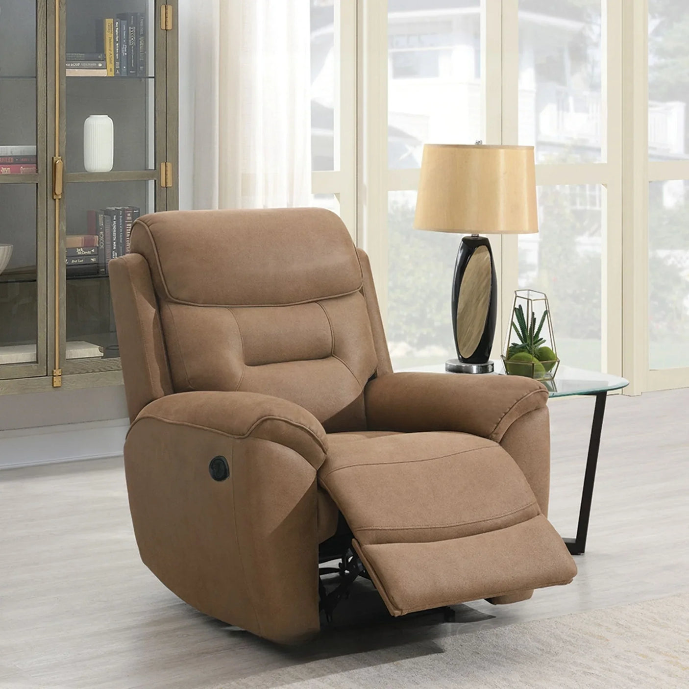Sand fabric recliner chair with footrest extended in living room near glass side table