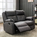 Dark grey 2 seater recliner sofa with plush cushions in modern living room setting