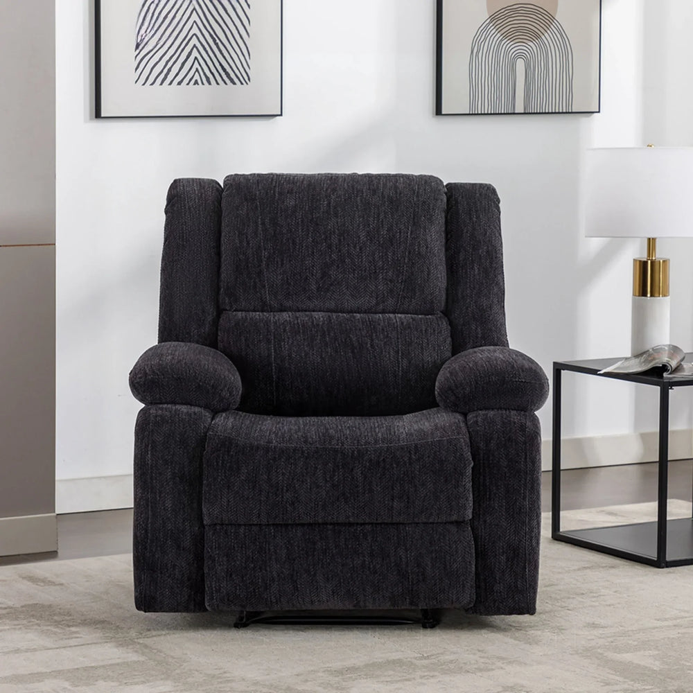 Charcoal fabric recliner armchair in modern living room with neutral decor and wall art