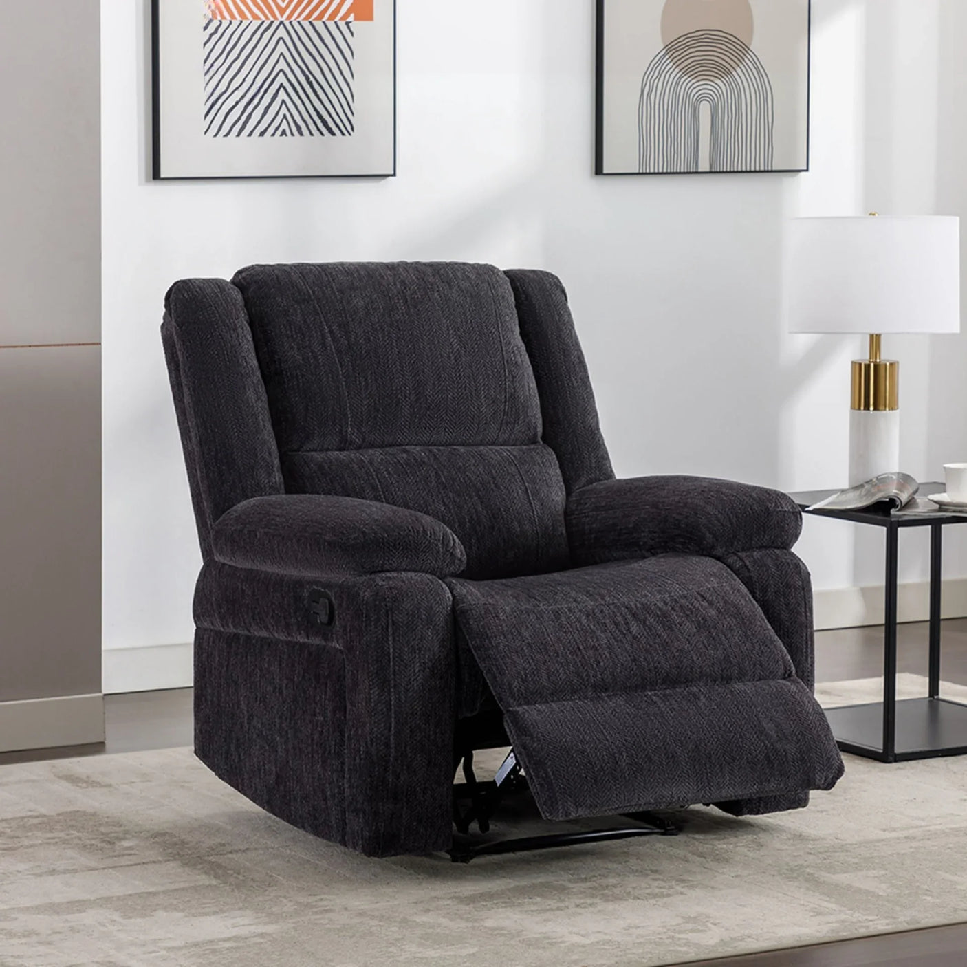 Charcoal fabric recliner armchair with footrest in a modern living room setting