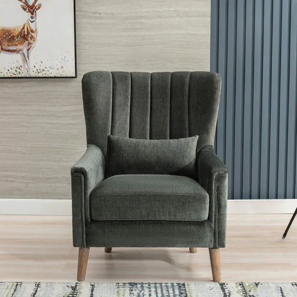 Winter moss green armchair with vertical channel backrest and wooden legs in modern room
