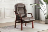Tan orthopedic chair with cushioned seat and wooden arms on a modern area rug