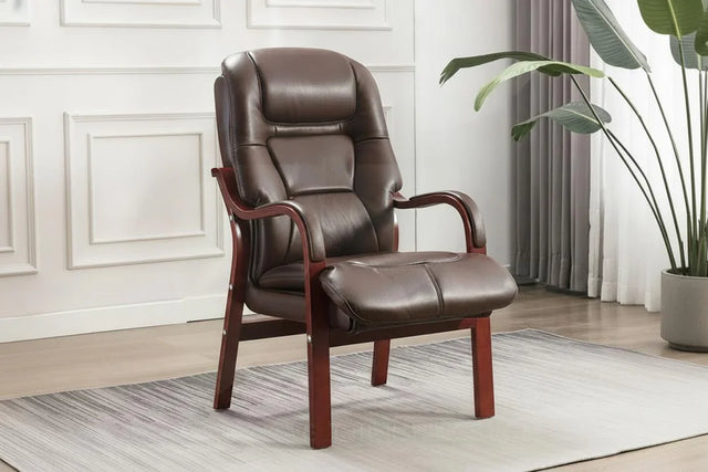 Tan orthopedic chair with cushioned seat and wooden arms on a modern area rug
