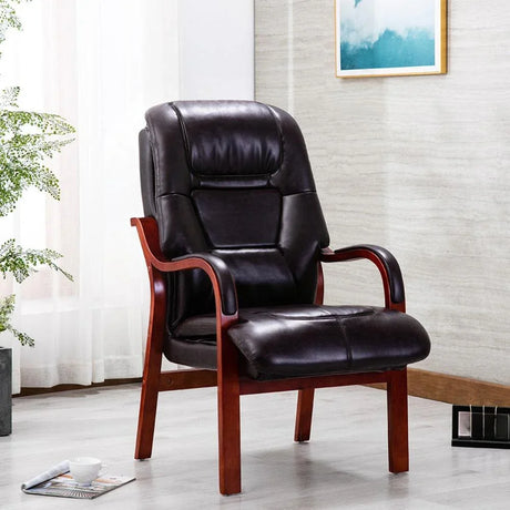 Orthopedic chair with burgundy faux leather seat and wooden arms in a modern living room