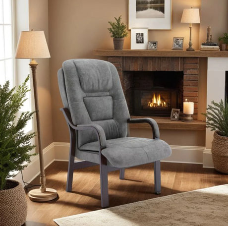 Slate grey orthopaedic chair with padded seat and wooden arms in living room setting
