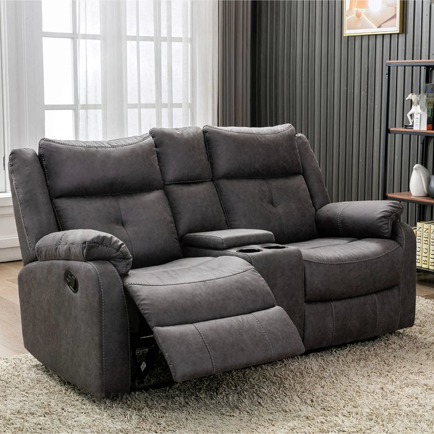 Grey fabric 2 seater recliner sofa with console and cup holders in living room