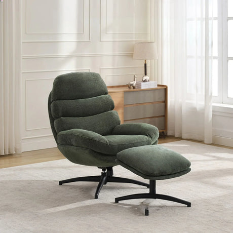 Green leisure chair with footstool set on black metal base in modern living room
